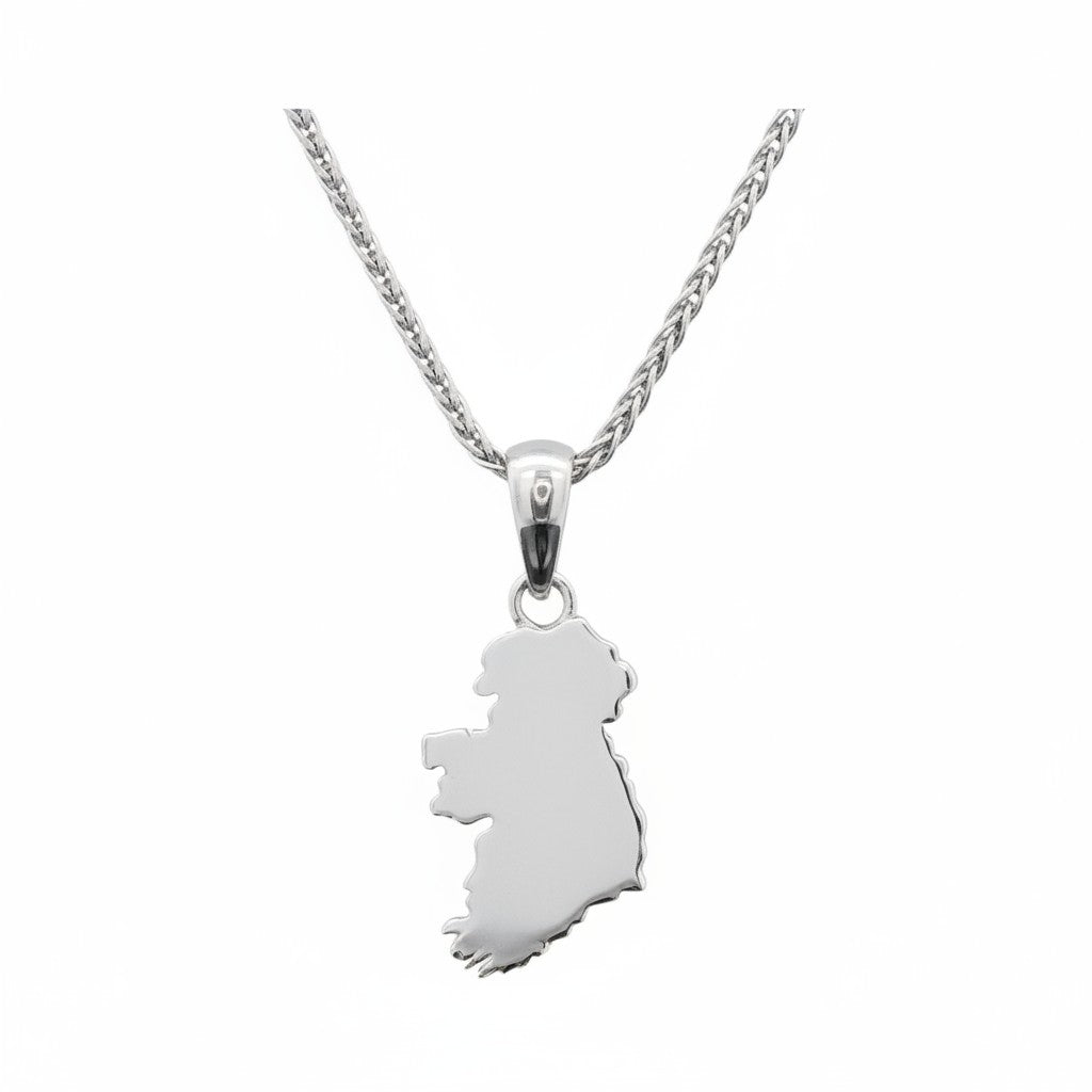 Silver necklace with a pendant shaped like map of Ireland on a white background