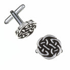 Silver cufflinks with intricate Celtic knot design on a white background