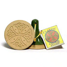 Cookie stamp with intricate design and packaging on a white background
