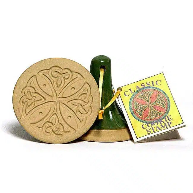 Cookie stamp with intricate design and packaging on a white background