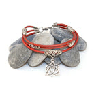 Red leather bracelet with silver Celtic knot charm on stones