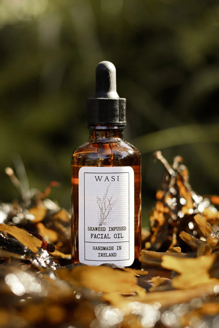 Facial oil bottle with dropper labeled 'WASI on a natural background.  Irish Seaweed infused oil.