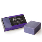 Purple soap bar with packaging labeled 'Highland Lavender' on a white background