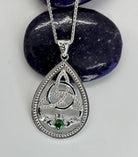 Silver pendant with Trinity Knot & Claddagh design and green gemstone 