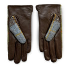 A pair of dark brown leather gloves with textured gray and yellow plaid woolen thumb patches, displayed side-by-side on a white background.