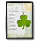Green shamrock pendant on a card with text in a decorative frame