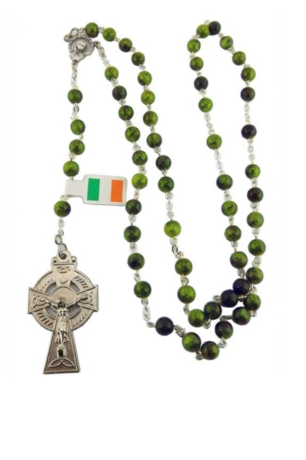 Green Connemara marble round rosary beads necklace with a silver cross pendant on a white background