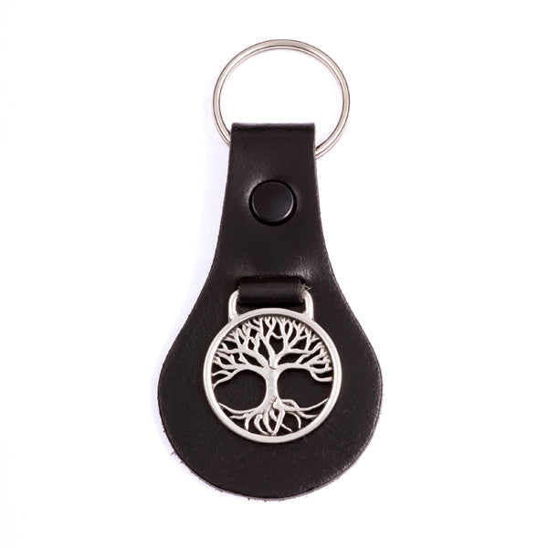 Black leather keychain with silver tree of life design on a white background