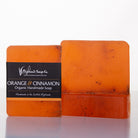 Orange handmade soap with 'Highland Soap Co.' label on a white background