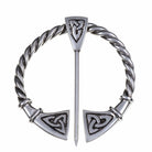 Pewter brooch with twisted design and triangular emblem on a white background