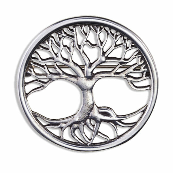 Silver tree of life design brooch on a white background