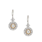 Pair of earrings with pearl centers on a white background