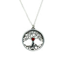 Silver tree of life pendant with a red gemstone on a white background