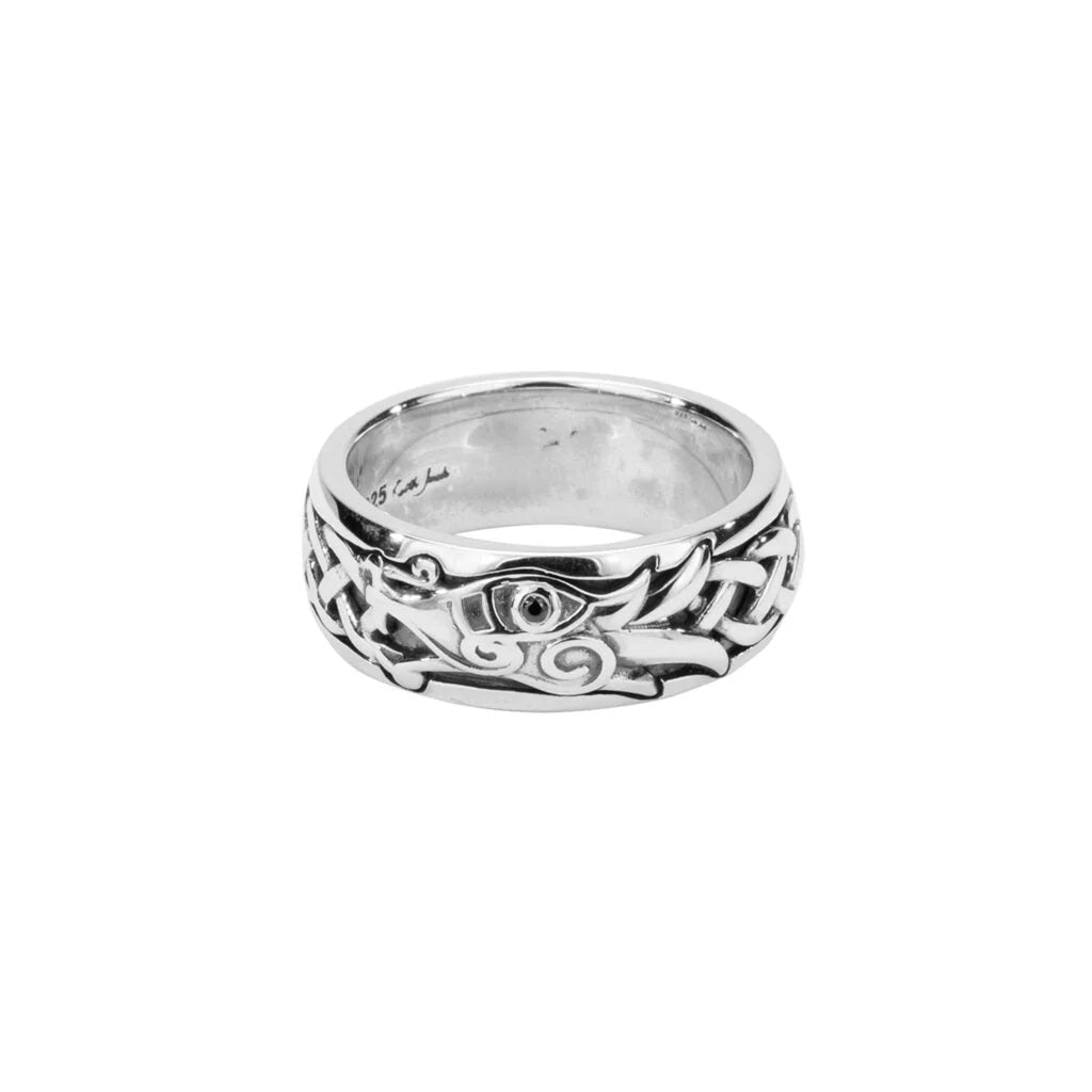 Silver ring with celtic dragon intricate design on a white background