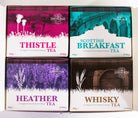 Four boxes of Edinburgh tea with different flavors on a white background