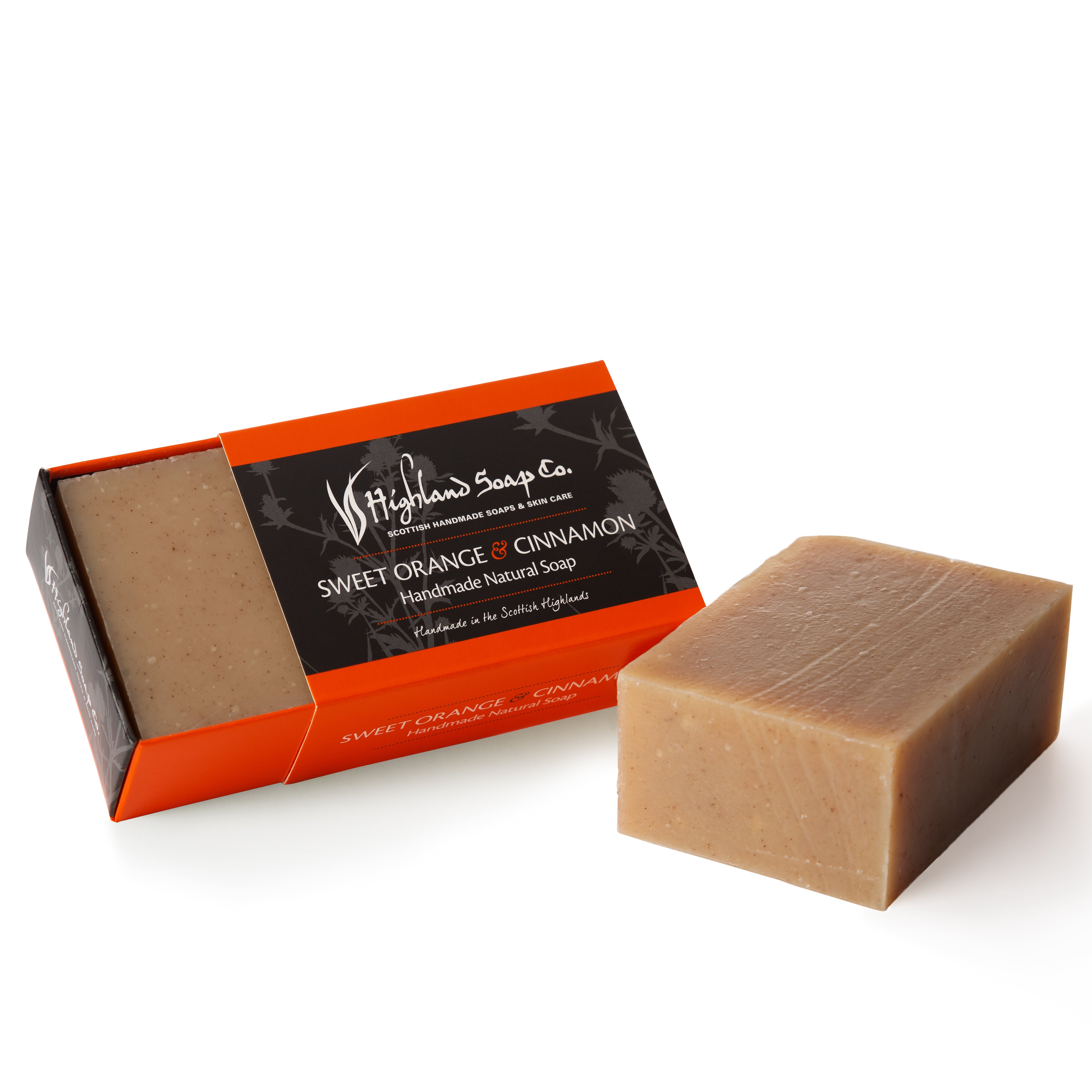 Bar of soap with packaging labeled 'Highland Soap Co.' on a white background