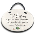 Round ceramic plaque with text 'You & I are Sisters. If you fall, I will ALWAYS be there to pick you up.
