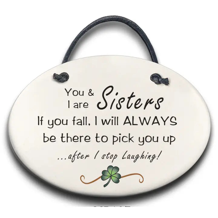 Round ceramic plaque with text 'You & I are Sisters. If you fall, I will ALWAYS be there to pick you up.