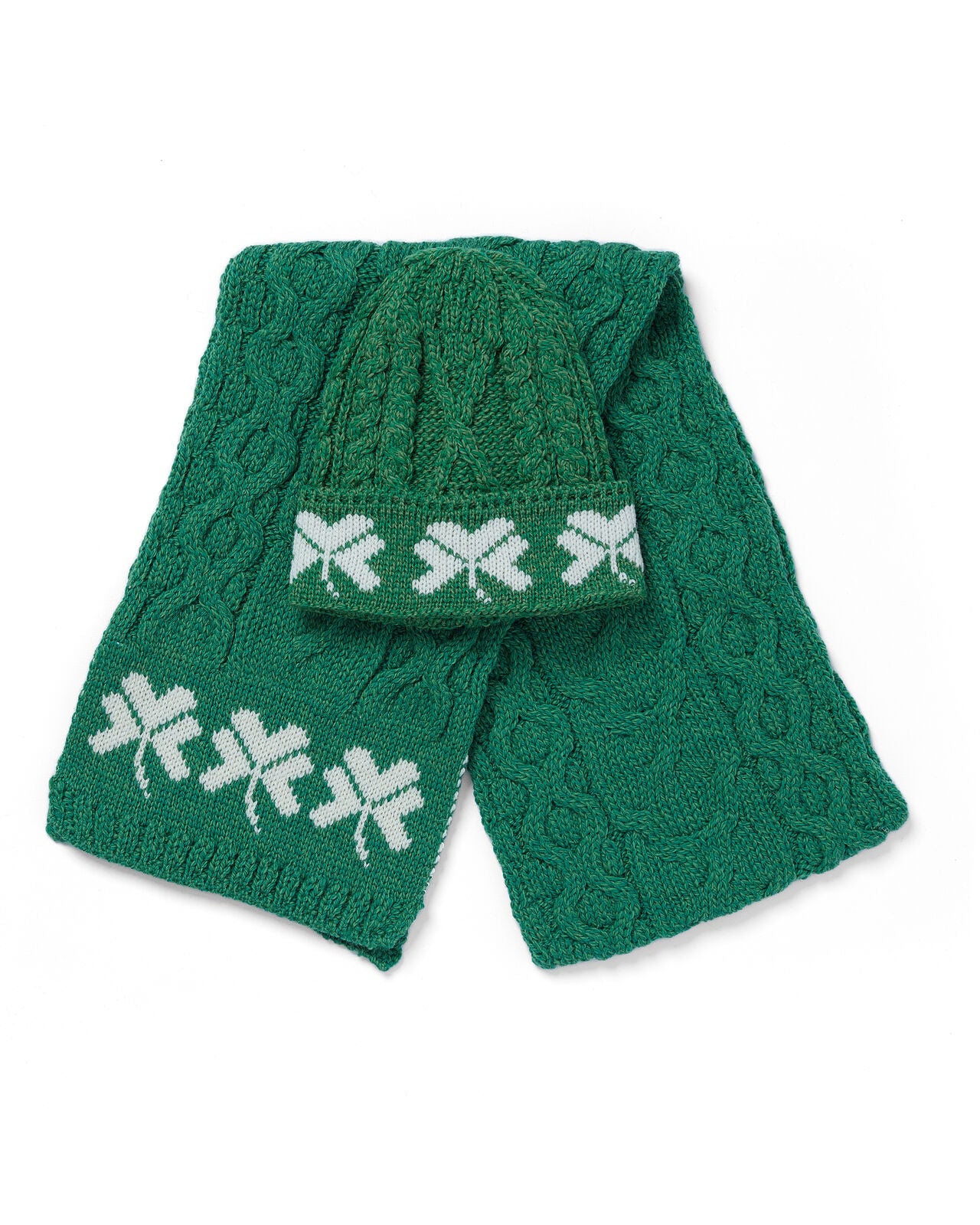 Green knitted scarf with white patterns on a white background