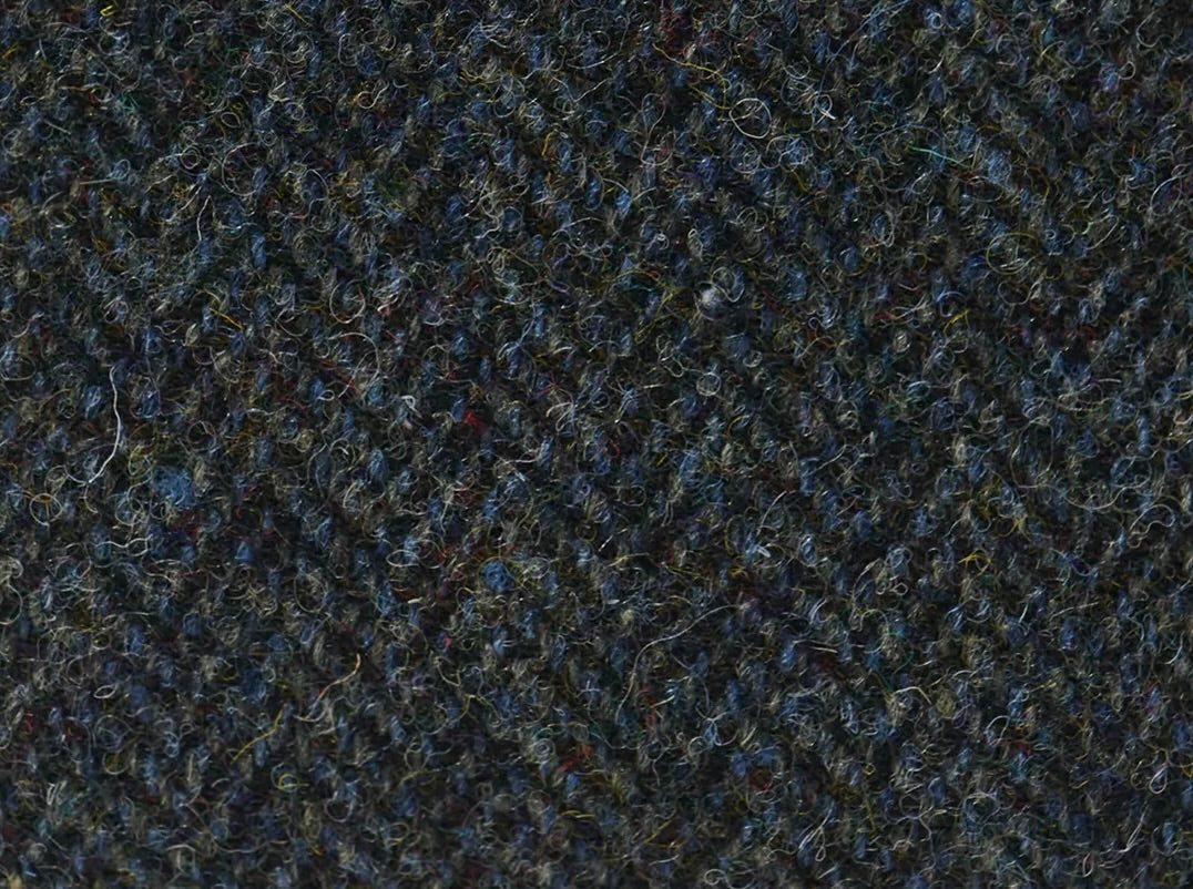 Close-up of textured dark fabric with a subtle pattern