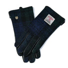 Pair of dark blue gloves with brand labels on a white background