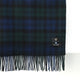 Plaid blanket with fringes and a brand label on a white background