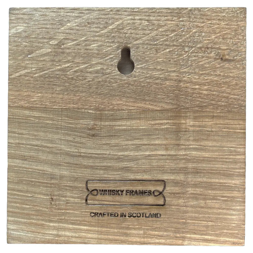 A square wooden wall plaque or frame back panel with a hanging keyhole cutout and the printed brand name 'Whisky Frames' and 'Crafted in Scotland' near the bottom.