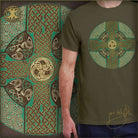 Person wearing a green t-shirt with Celtic cross design in front of a detailed Celtic cross artwork.