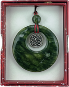 Green Irish connemara marble pendant with silver emblem in a red box
