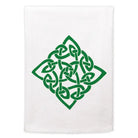 White towel with green Celtic knot design on a white background