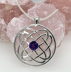 Silver Celtic knot pendant with an amethyst stone on a white background
