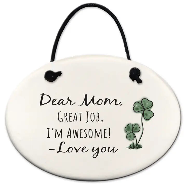 Round ceramic hanging plate with text 'Dear Mom, Great Job, I'm Awesome! Love you' and clover design on a white background.