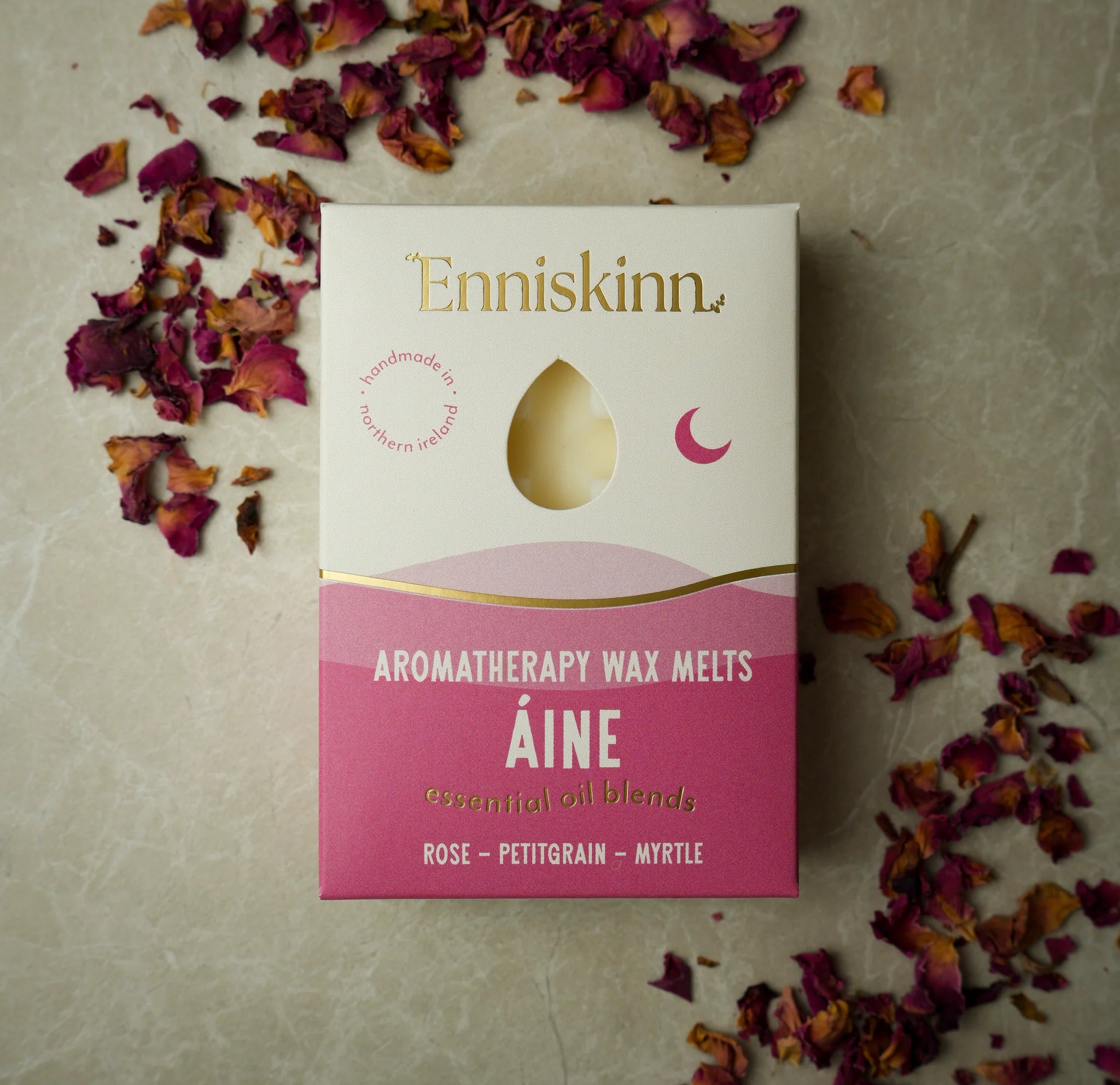 Enniskinn Aromatherapy Wax Melts packaging with dried flowers on a textured surface
