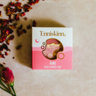 Enniskinn Aine Irish Seaweed Soap packaging on a textured surface with dried flowers.
