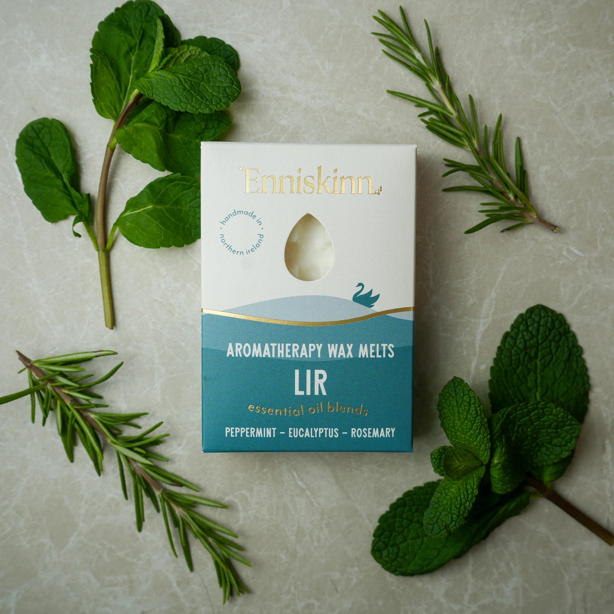 Enniskinn Aromatherapy Wax Melts packaging with mint leaves on a textured surface