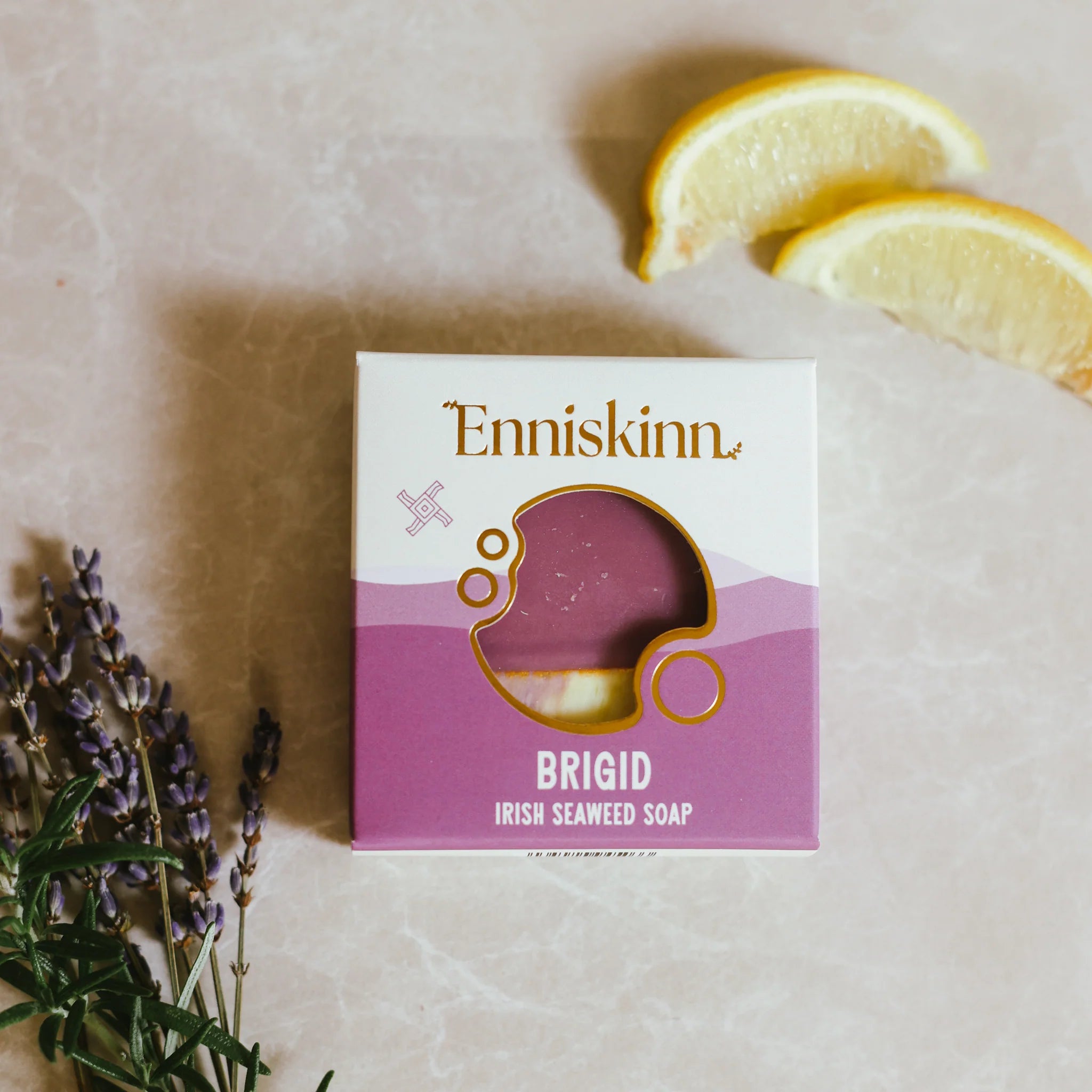 Enniskinn Brigid Irish Seaweed Soap packaging with lavender and lemon slices on a light background