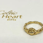Gold ring with claddagh design on a white card with 'Celtic Heart Gifts' text.