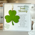 Decorative item with shamrock and text about grandparents' Irish blessing on a neutral background.