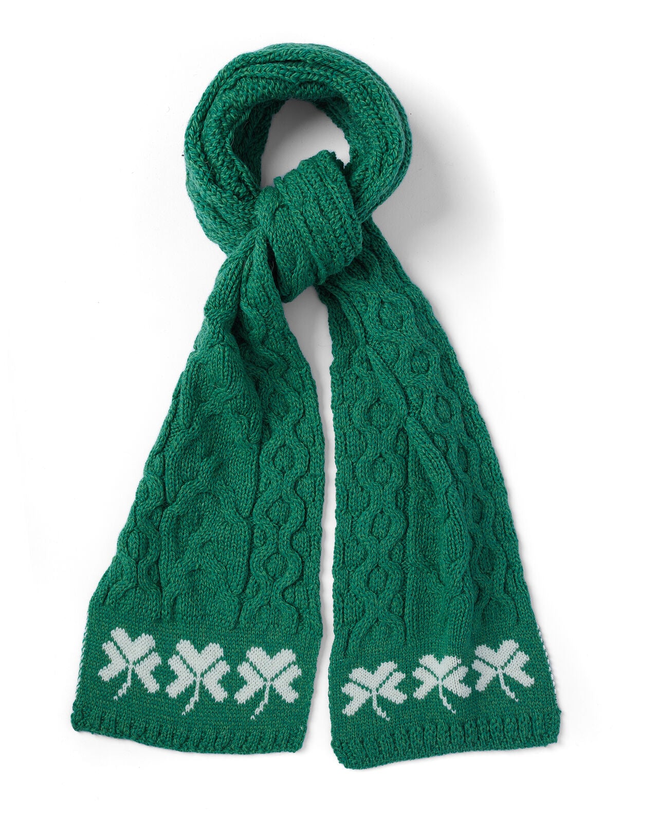 Green knitted scarf with shamrock pattern on a white background