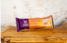 Belgian Chocolate Biscuit Bar packaging on a wooden surface with a textured background