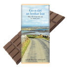 Chocolate bar with a scenic packaging featuring a road and landscape.
