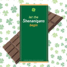 Green chocolate bar packaging with 'let the Shenanigans begin' text on a shamrock pattern background