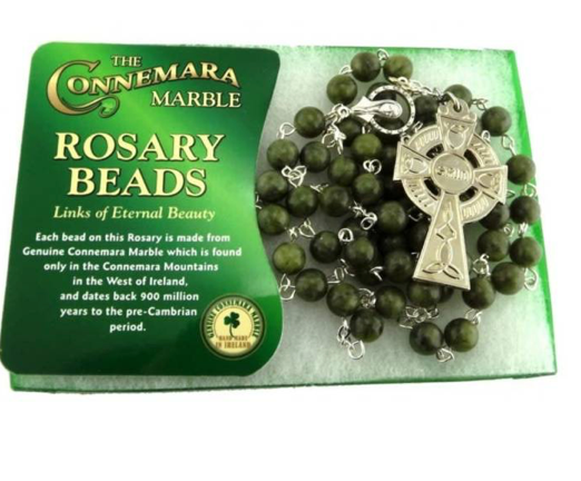 Rosary beads with Connemara Marble packaging on a white background