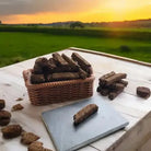 Basket of pet treats on a wooden surface with a scenic background