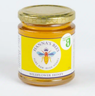 Jar of Hanna's Bees wildflower honey on a white background
