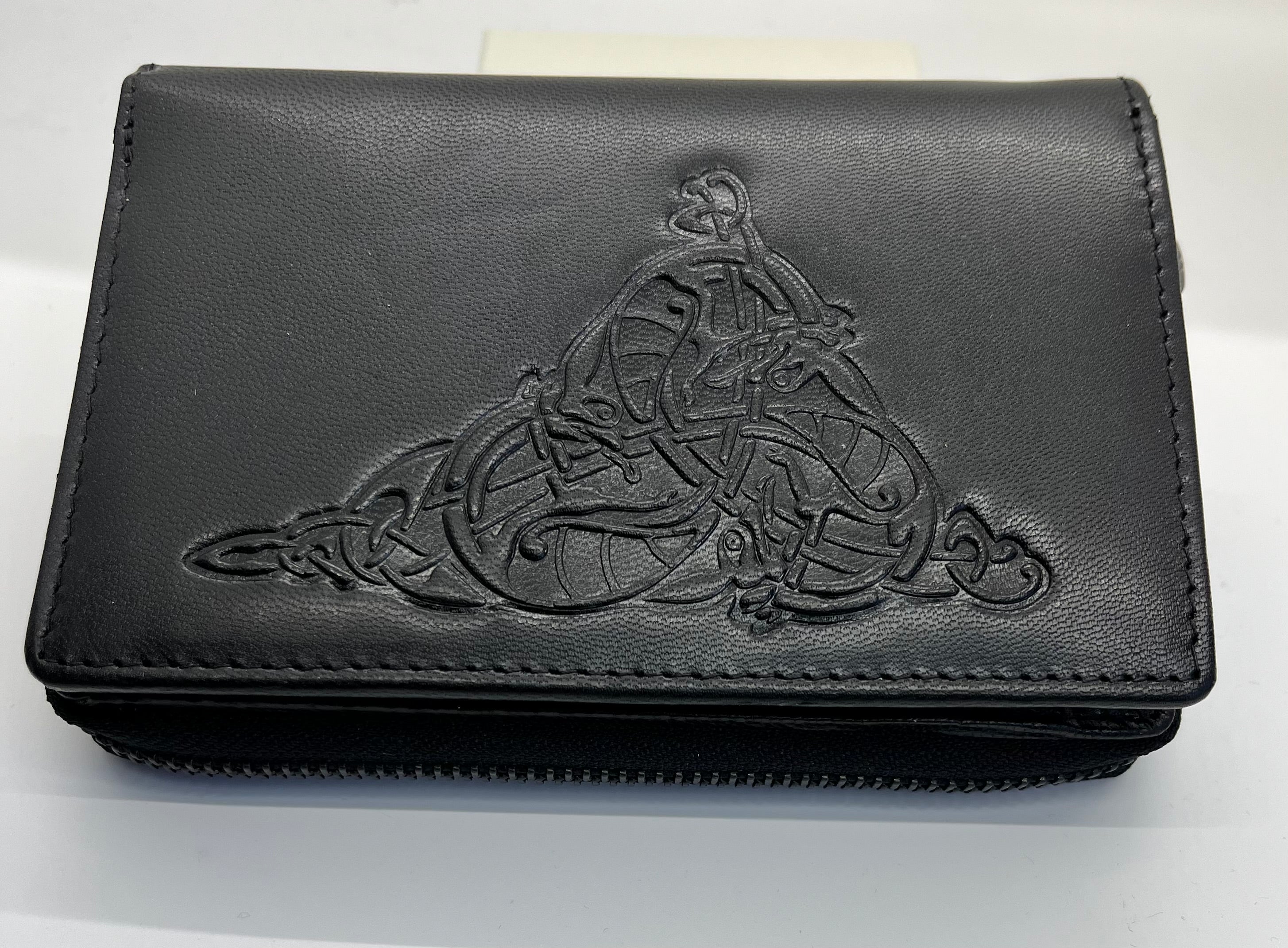 Black leather wallet with embossed design on a white background
