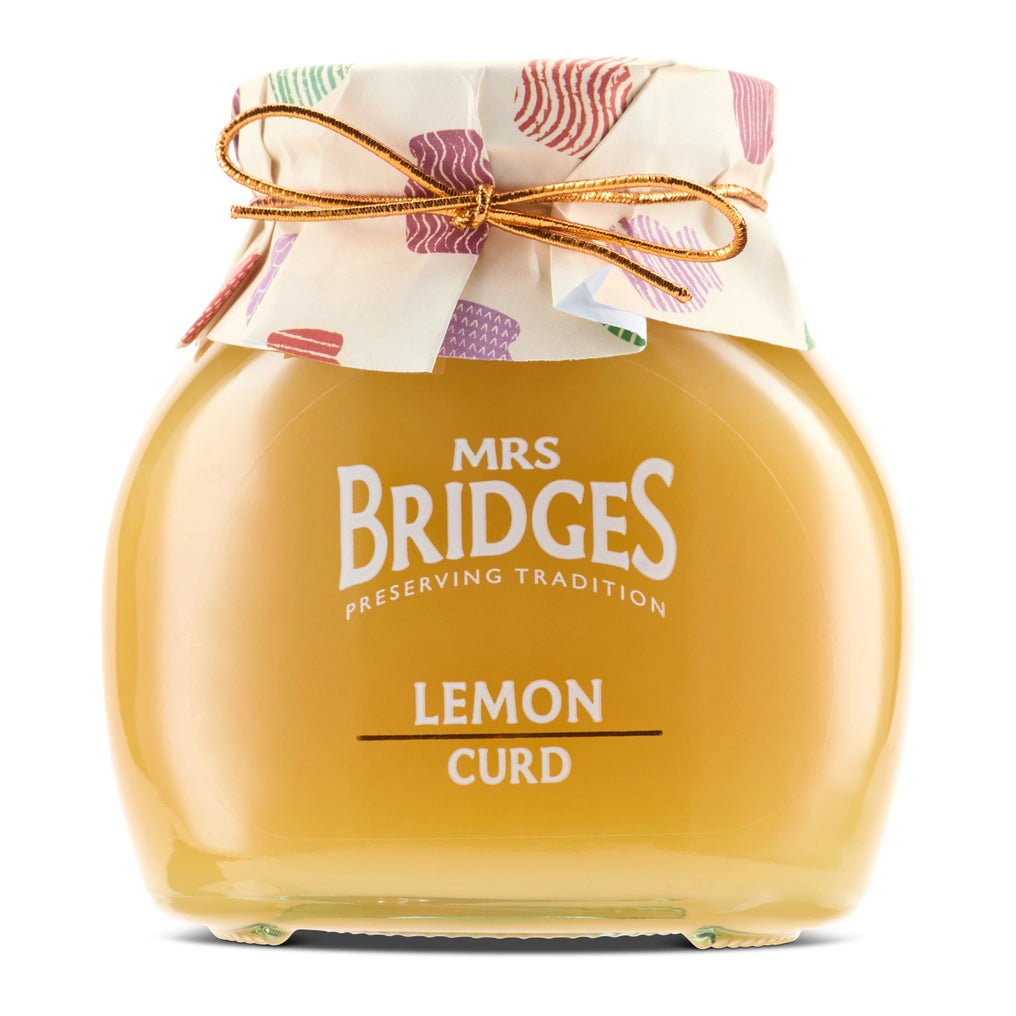 Jar of Mrs. Bridges Lemon Curd with decorative paper and ribbon on a white background
