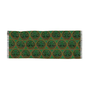 A rectangular scarf with fringe on both ends, featuring a repeating pattern of green circular medallions with tree-of-life motifs on a green background.