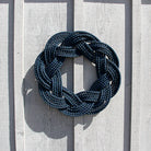 Blue rope knot on a wooden surface