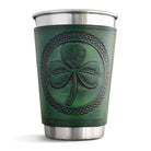 Green leather cup with shamrock design and silver base on a white background